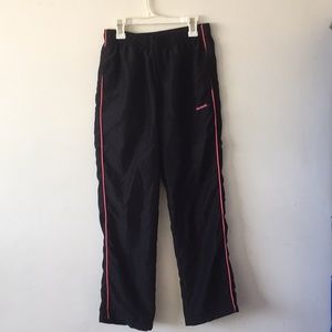 black and pink reebok track pants